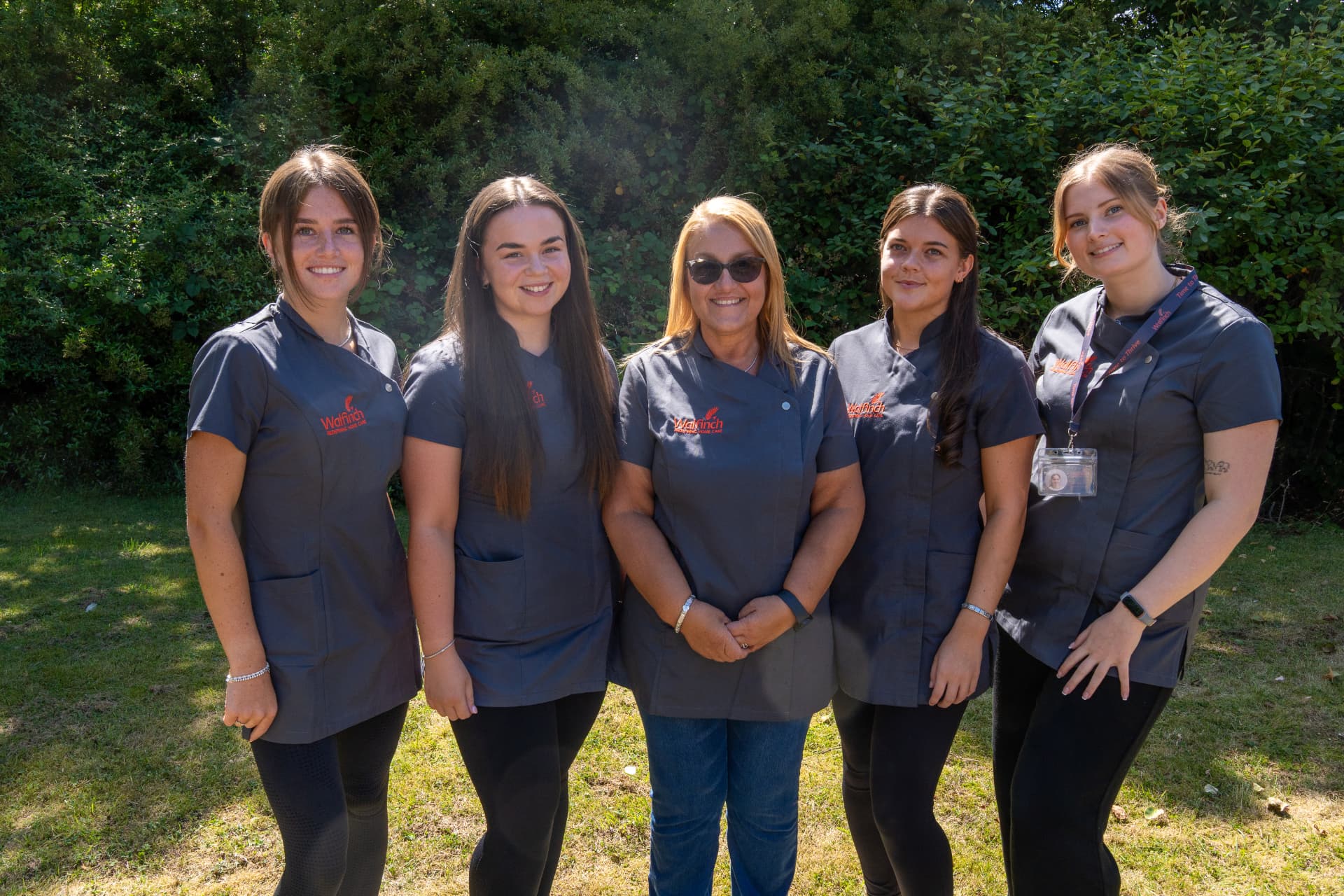 Five Walfinch Newcastle carers standing together outdoors