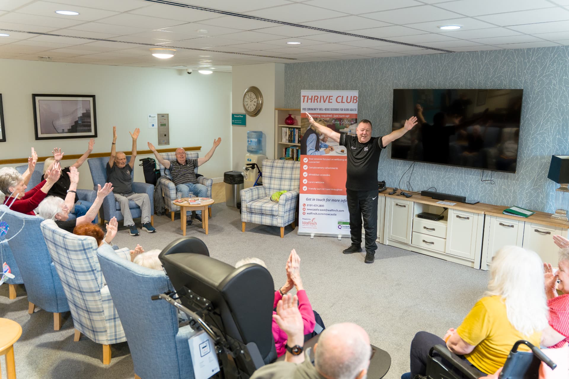 Members and an instructor taking part in a seated exercise session at a Walfinch Newcastle Thrive Club