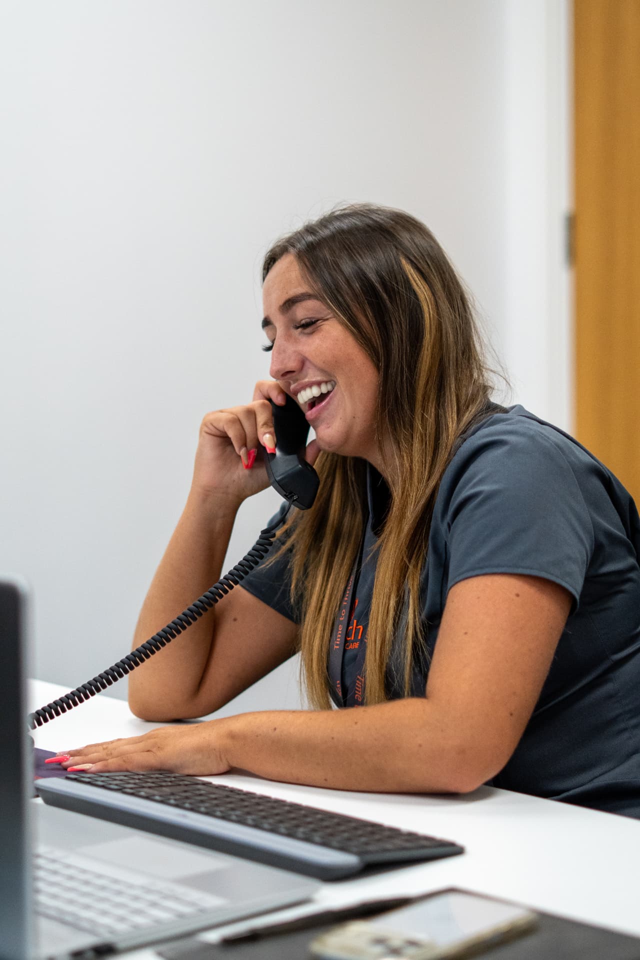 A member of the Walfinch Newcastle office team taking a phone call