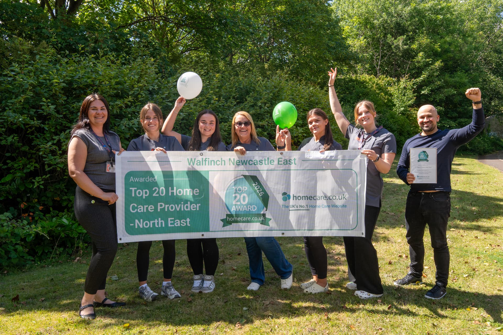 The Walfinch Newcastle team celebrating their Top 20 Home Care Provider award outdoors